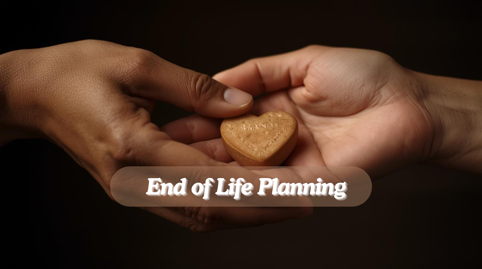 A hand passing a heart-shaped token to another hand 